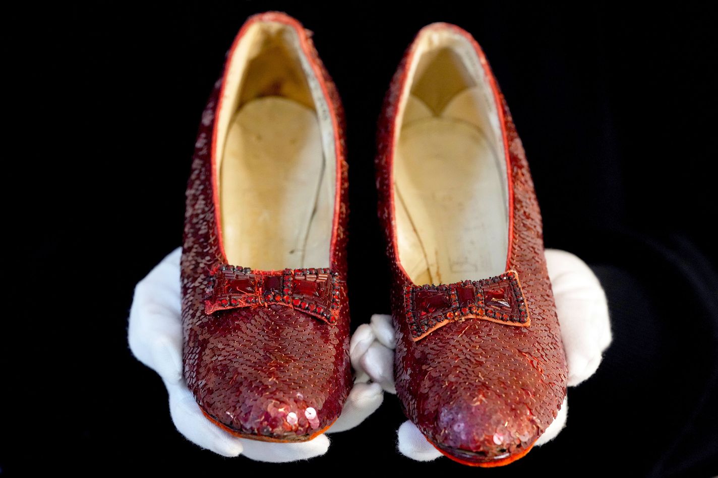 The original ruby slippers worn by Judy Garland in the classic 1939 film The Wizard of Oz are displayed in London ahead of being offered for auction on Dec. 7, at Heritage Auctions