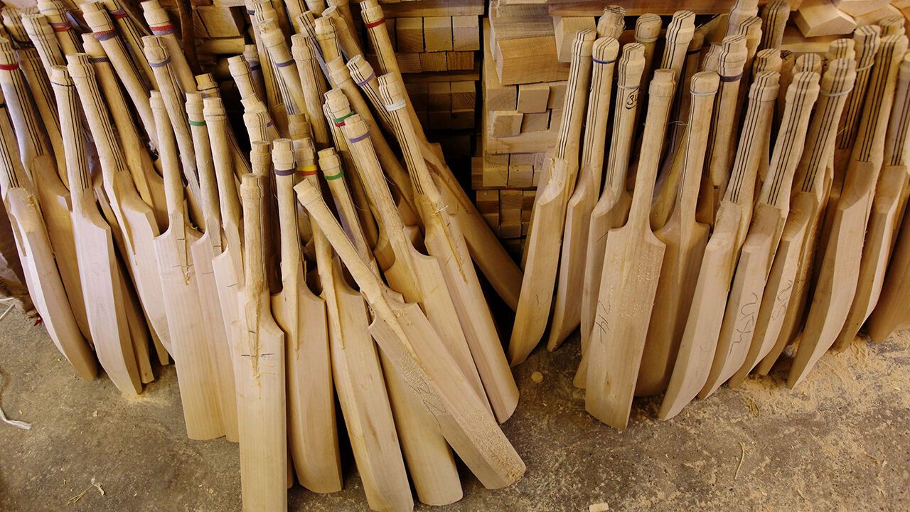 Partially complete bats stand awaiting sanding in a workshop in Chelmsford