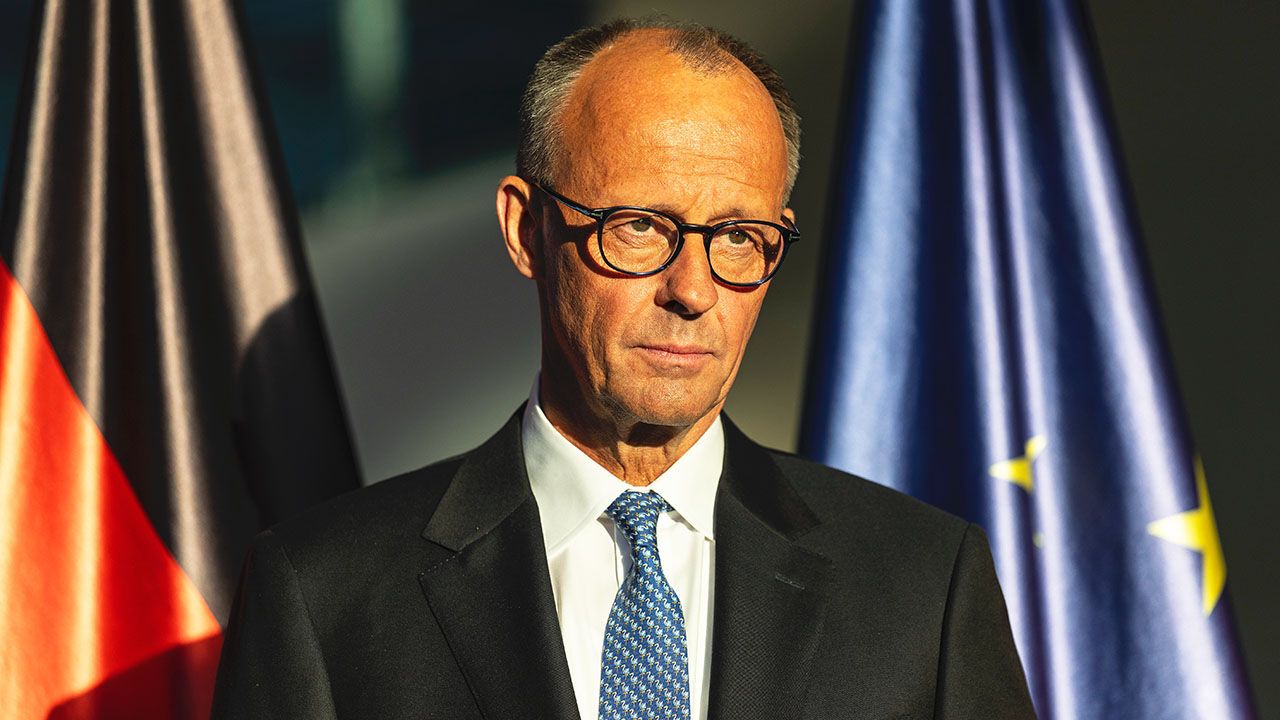 Friedrich Merz looking downcast.