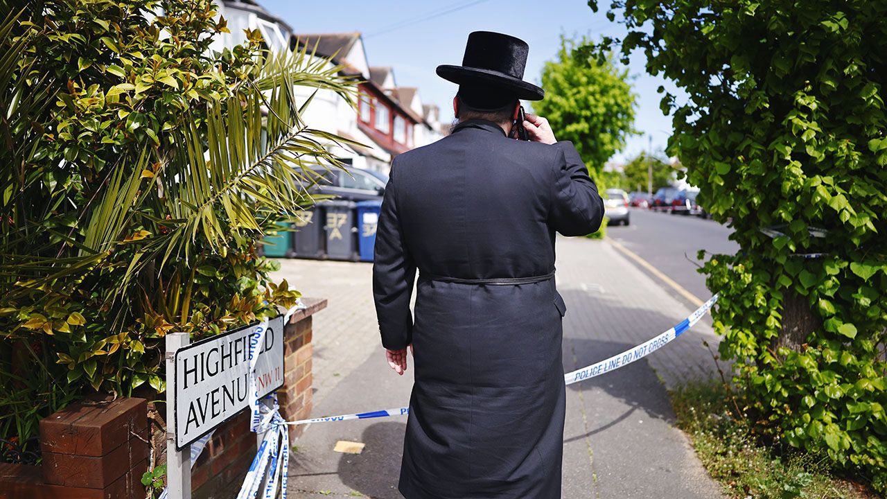 A member of the Jewish community looks at the scene where two Jewish men are seriously injured after being stabbed in Golders Green, London, April 29th 2026