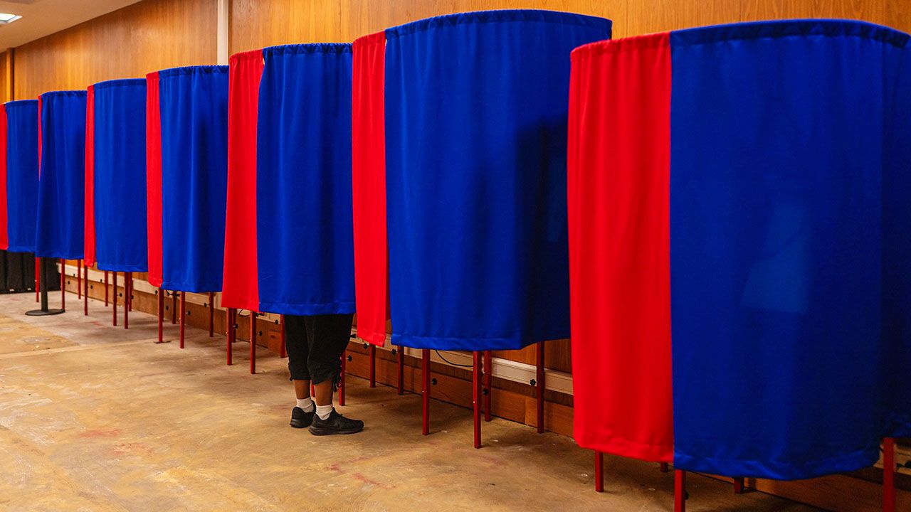 A ballot is cast during early voting at City Hall in Baton Rouge, La.