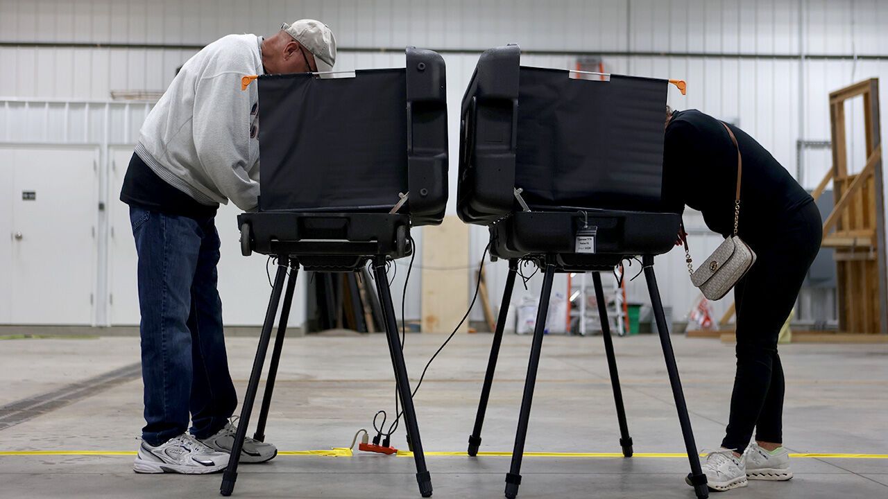 Voters place their votes in the Indian primary election