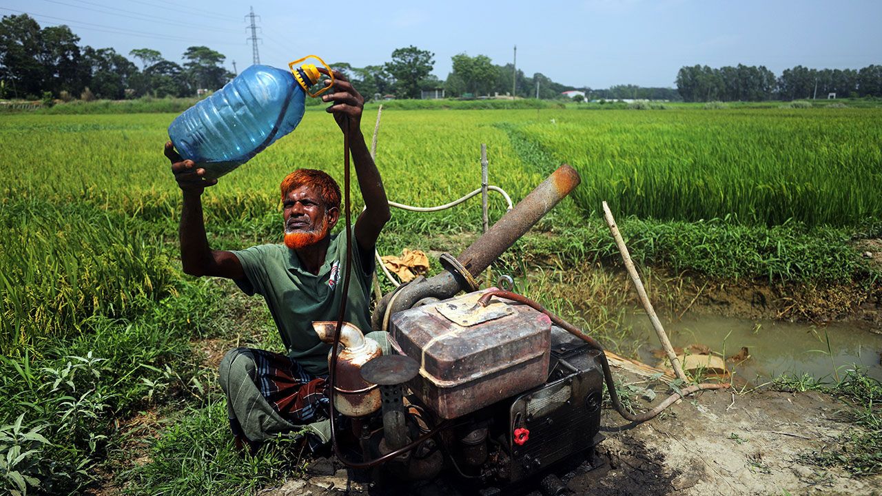 Farmers wait in front of fuel stations for diesel in Munshiganj, Bangladesh, on April 20, 2026.