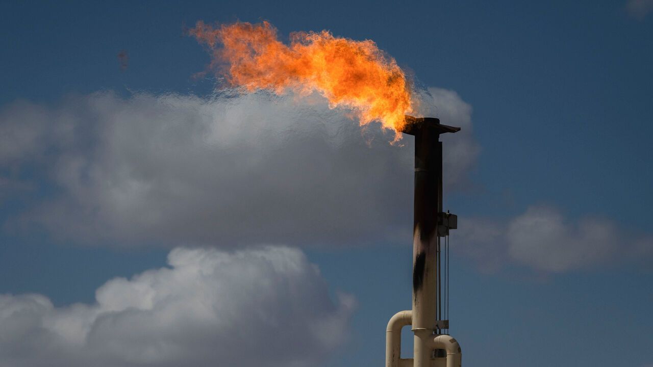 Flares burn off excess natural gas at the Endeavor Energy Resources LP oil and gas wells near Tarzan, Texas, USA.
