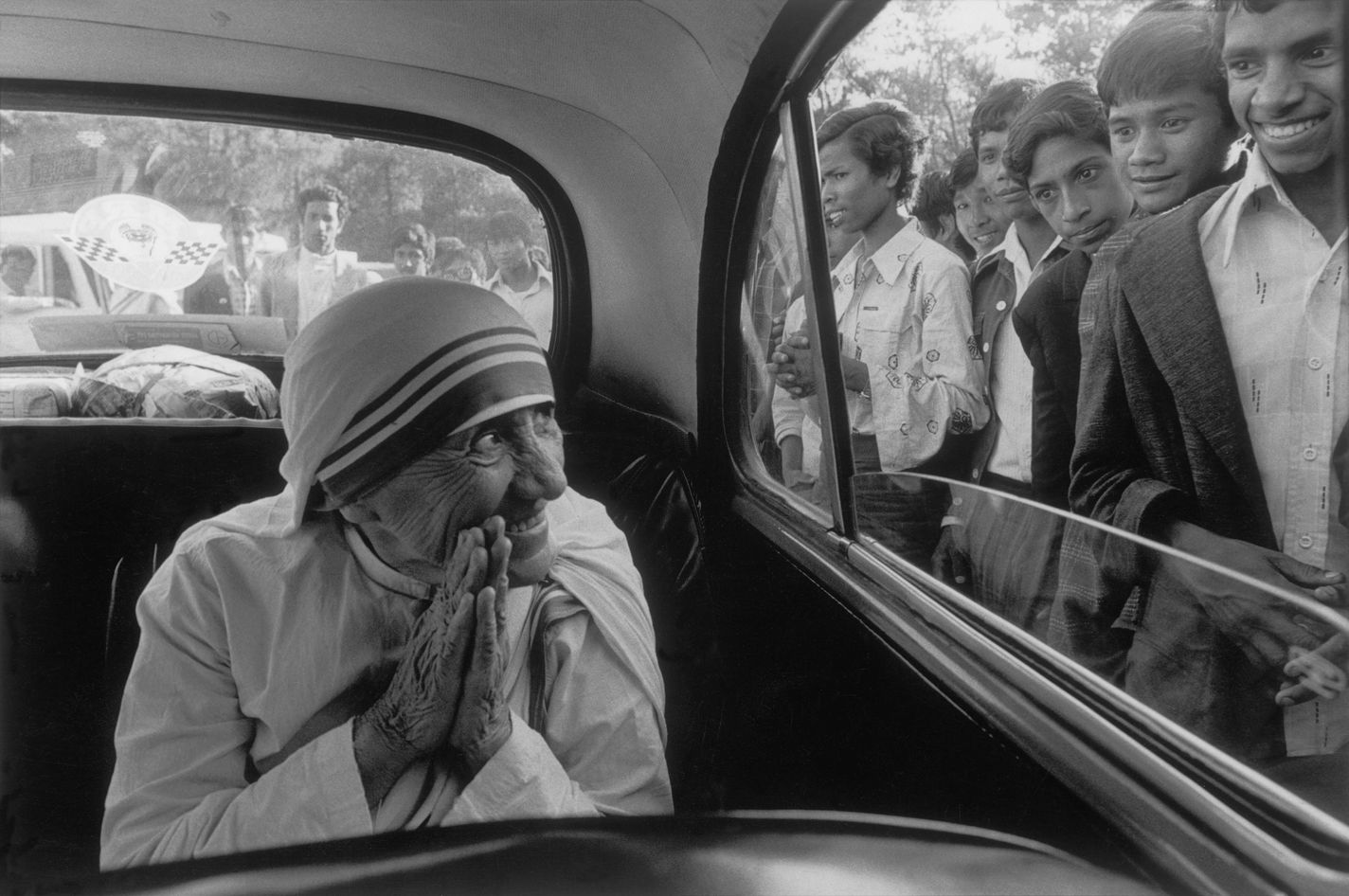 Mother Teresa being greeted during a visit to one of her missionaries, Shillom, Assaam, India