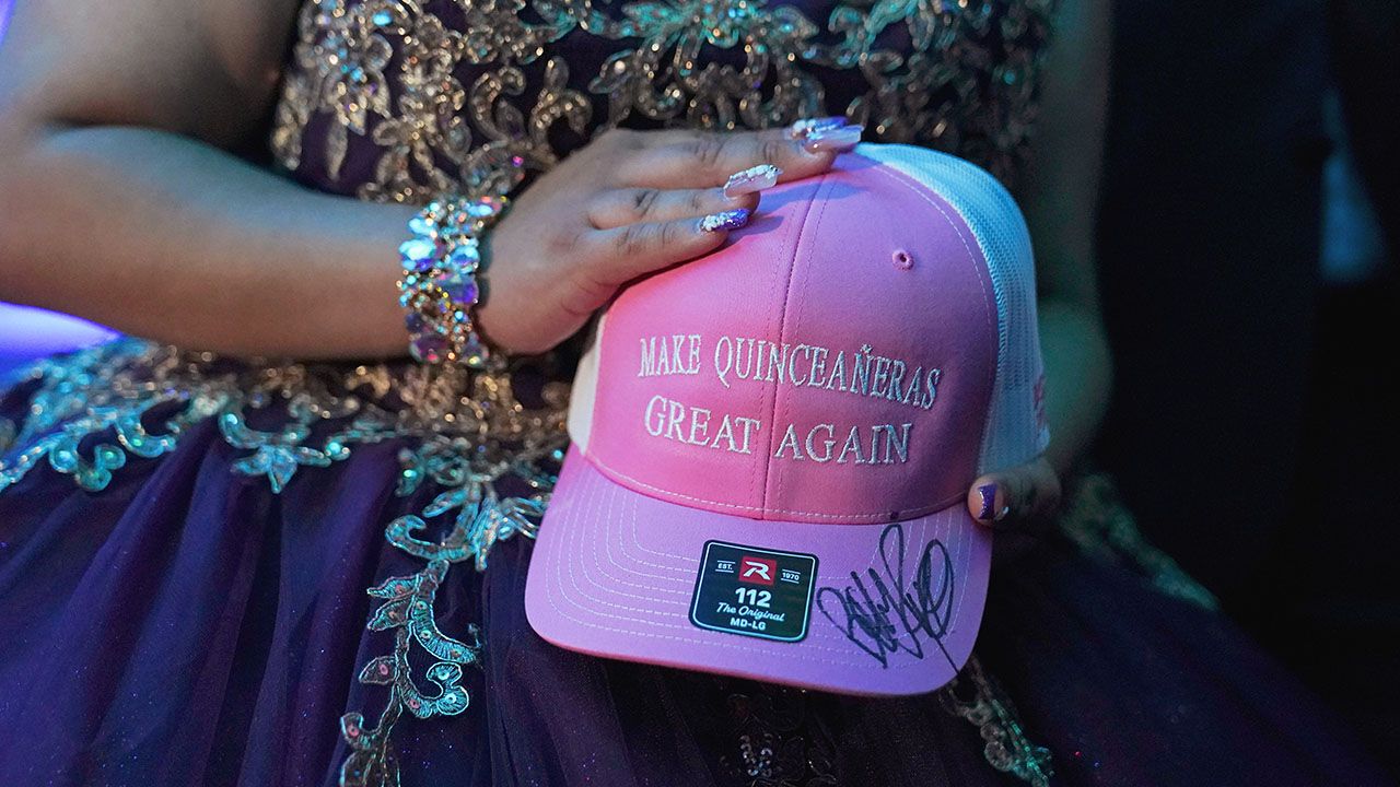 A pink cap from Bobby Pulido that reads "Make Quinceaneras Great Again"
