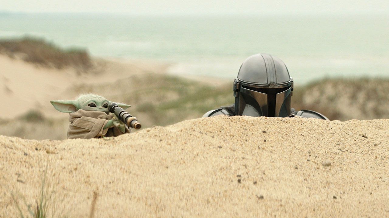 Pedro Pascal and Grogu in a scene from Lucasfilm's "The Mandalorian and Grogu."