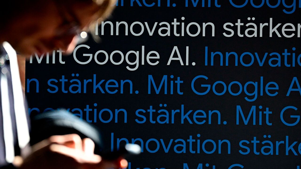 A journalist is pictured during the opening of a Google AI-Centre in Berlin.