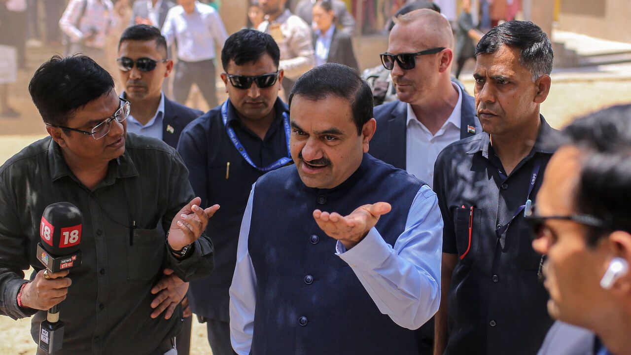 Gautam Adani, chairman of Adani Group leaves after casting his ballot at a polling station during the third phase of voting for national elections in Ahmedabad, Gujarat, India.