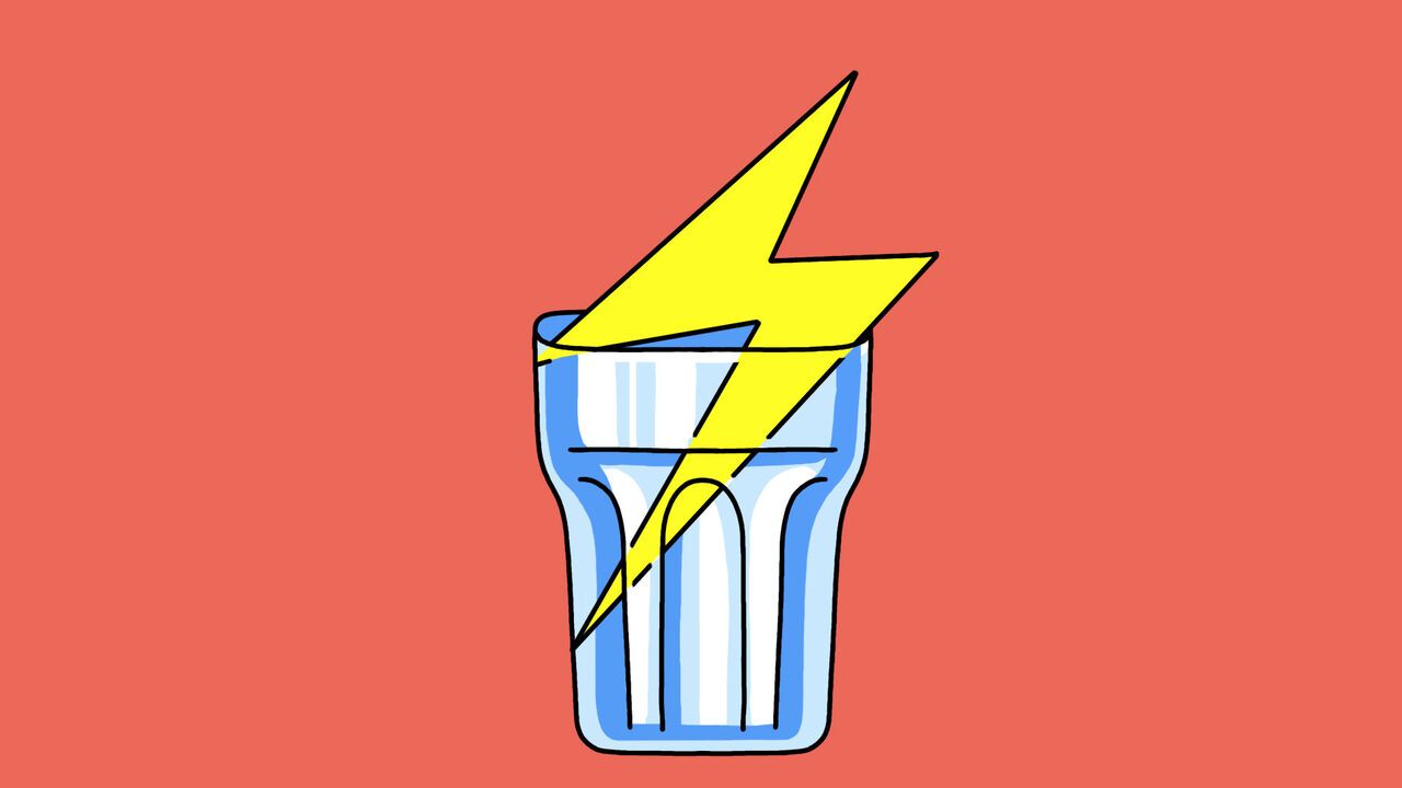 A glass cup containing a graphic lighting bolt