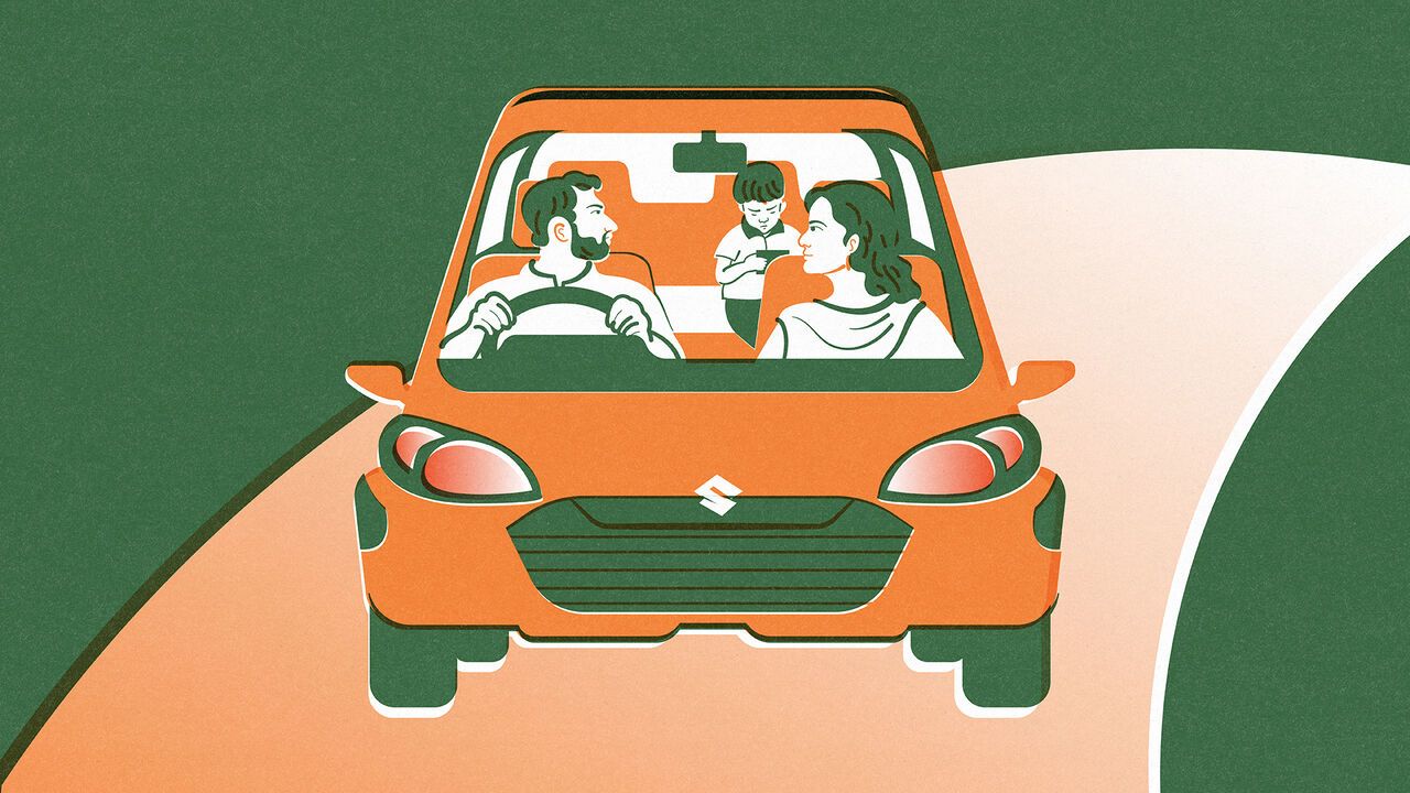A typical urban Indian nuclear family with one child, depicted inside a recognisably Indian car.