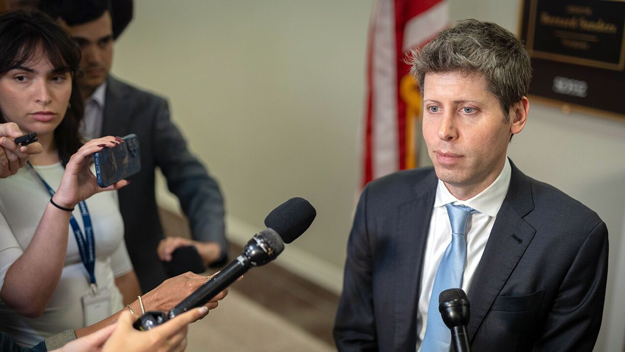 CEO of OpenAI Sam Altman talks to reporters