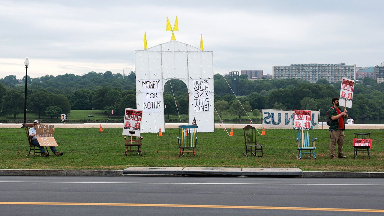 Demonstrators gather near Arlington Memorial Bridge to protest U.S. President Donald Trump's proposed 250-foot “Triumphal Arch” on May 26, 2026 in Washington, DC.