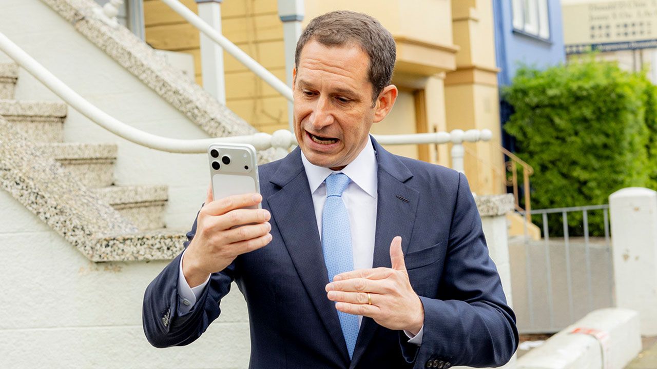 Daniel Lurie taling to a reporter
