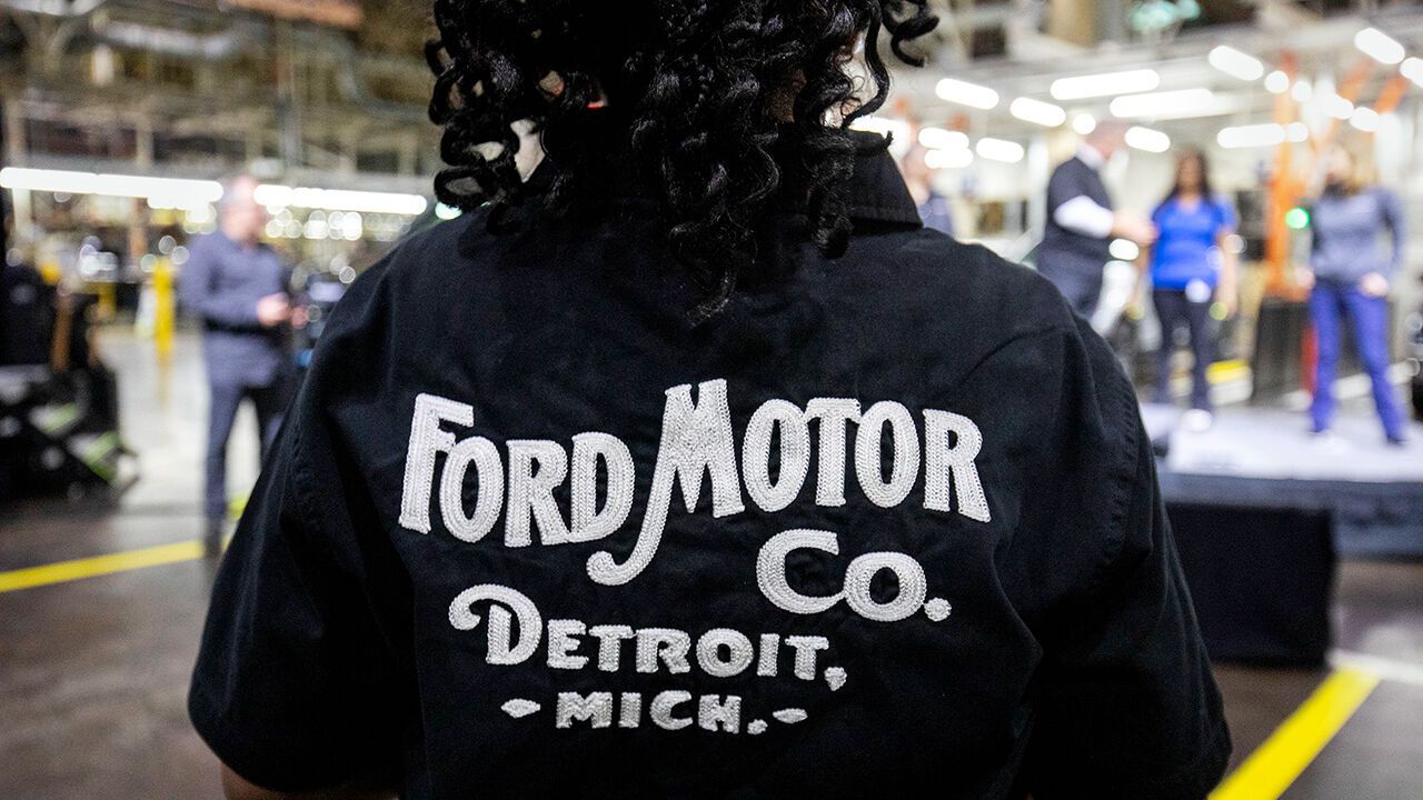 Worker wearing a Ford Motor Co shirt at the Ford Dearborn Plant, Dearborn, Michigan