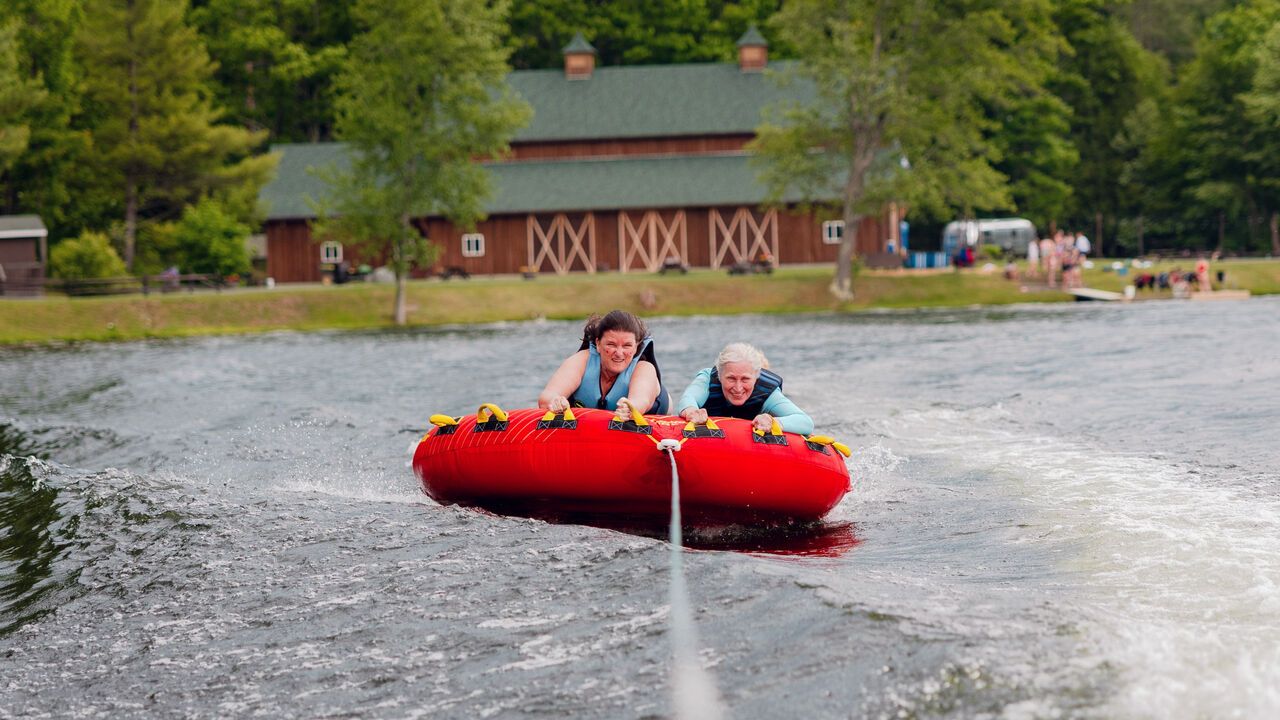 People tubing while attending Camp Social
