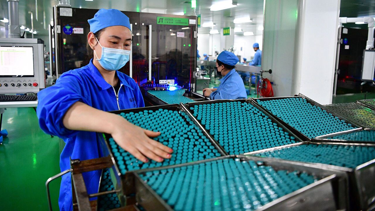 Employees work in a factory of Fusen Pharmaceutical Company in Nanyang, Henan Province, China