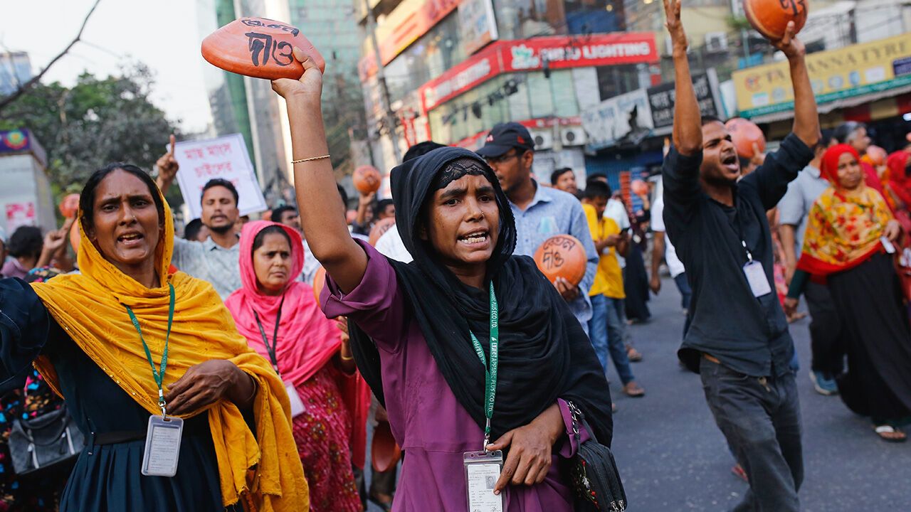 Garment workers and employees of the TNZ group stage a demonstration demanding their unpaid wages and bonuses in Dhaka, Bangladesh, on March 28, 2025.