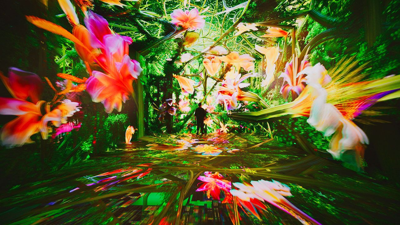 Person surrounded by visualisation in the Infinity room, Refik Anadol Studio's Dataland, the Museum of AI Arts at The Grand LA in Los Angeles.