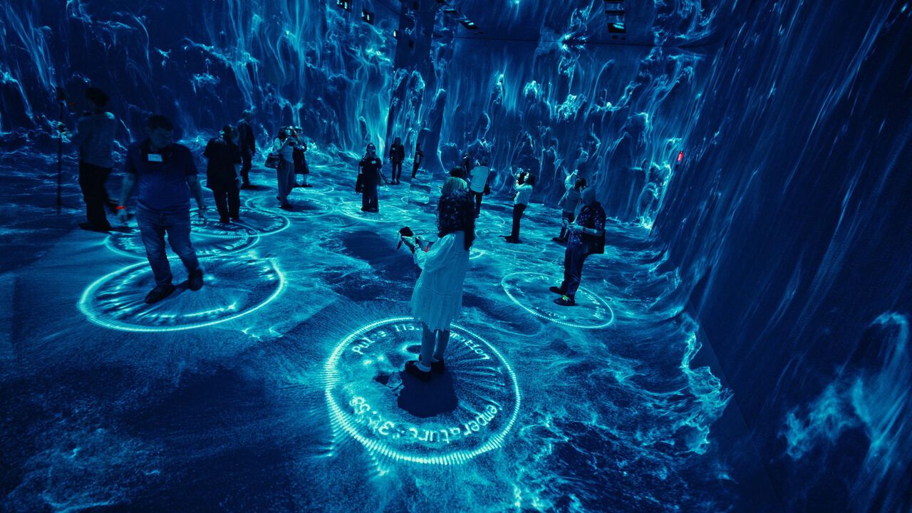 People experiencing Refik Anadol Studio's Dataland, the Museum of AI Arts at The Grand LA in Los Angeles.