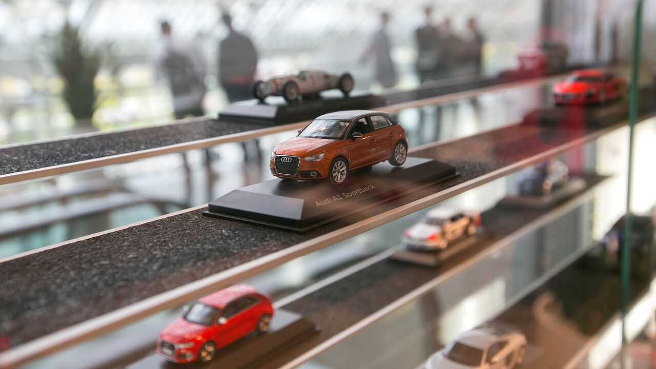 Toy cars sit in a display case in the gift shop at the Audi AG headquarters in Ingolstadt, Germany.