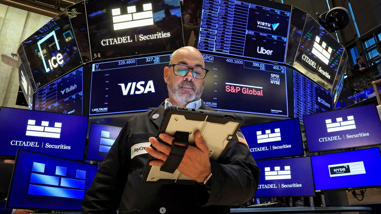 Traders work on the floor of the NYSE in New York