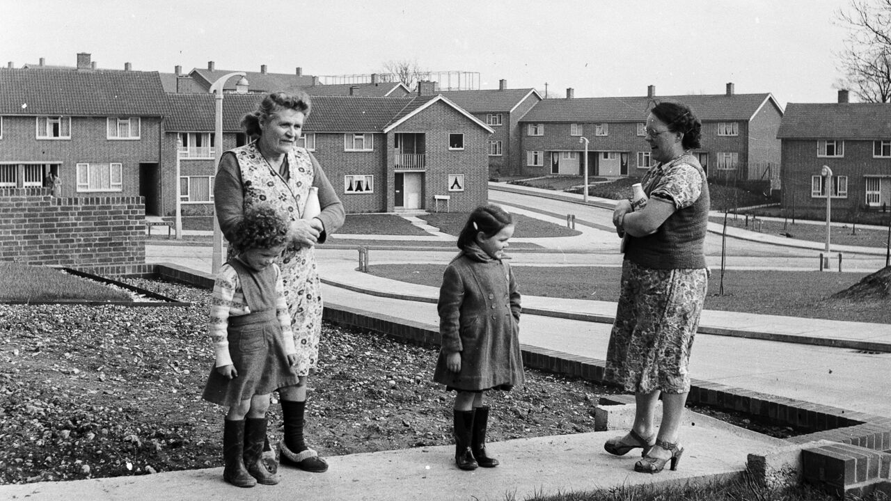 Two women and their children talking in a street of council housing in the new town of Hemel Hempstead, Hertfordshire.