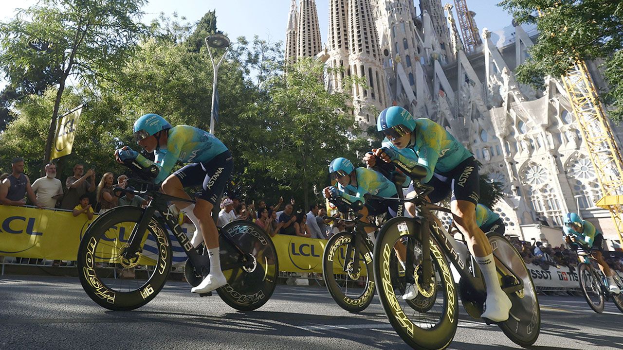 Riders of the XDS Astana Team compete in front of the Sagrada Familia Basilica in the 1st stage of the Tour de France
