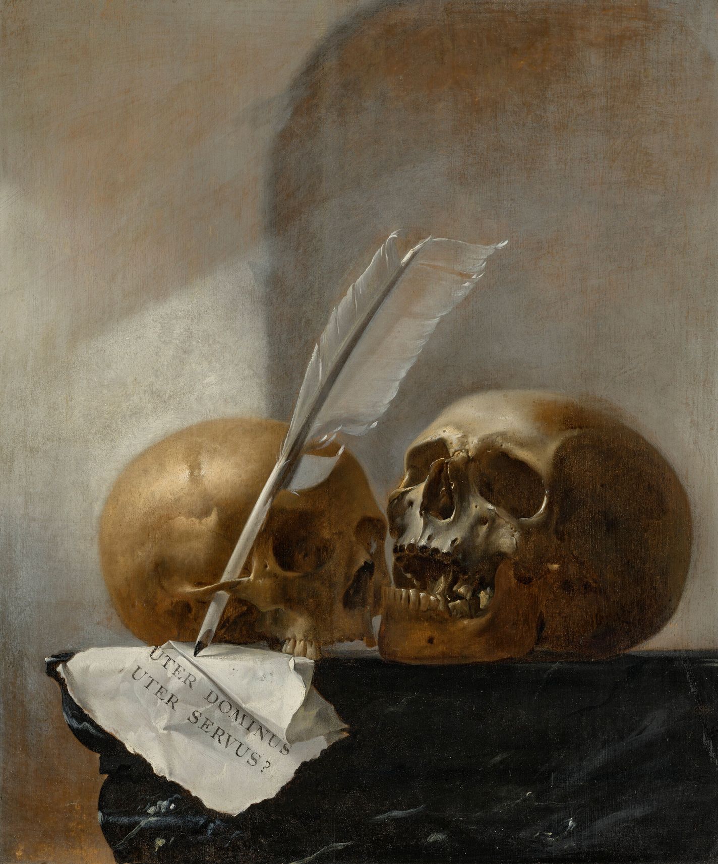 Two skulls with a quill and paper on a marble ledge, Dutch School 17th Century painting.