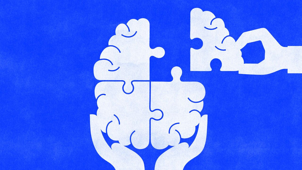 A hand places the final puzzle piece into a brain held in cupped hands, symbolizing restoring, completing, or improving mental health and cognitive wellbeing.