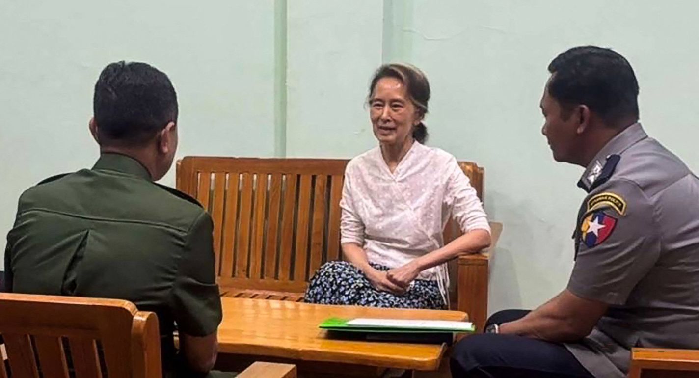This undated handout photo from the Myanmar Military Information Team released on April 30, 2026 shows Aung San Suu Kyi (C) talking in an undisclosed location. 