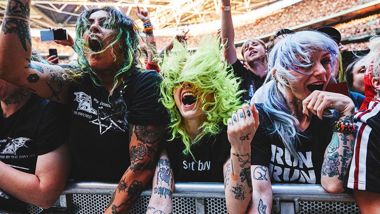 Fans in the crowd of a My Chemical Romance gig at Wembley.