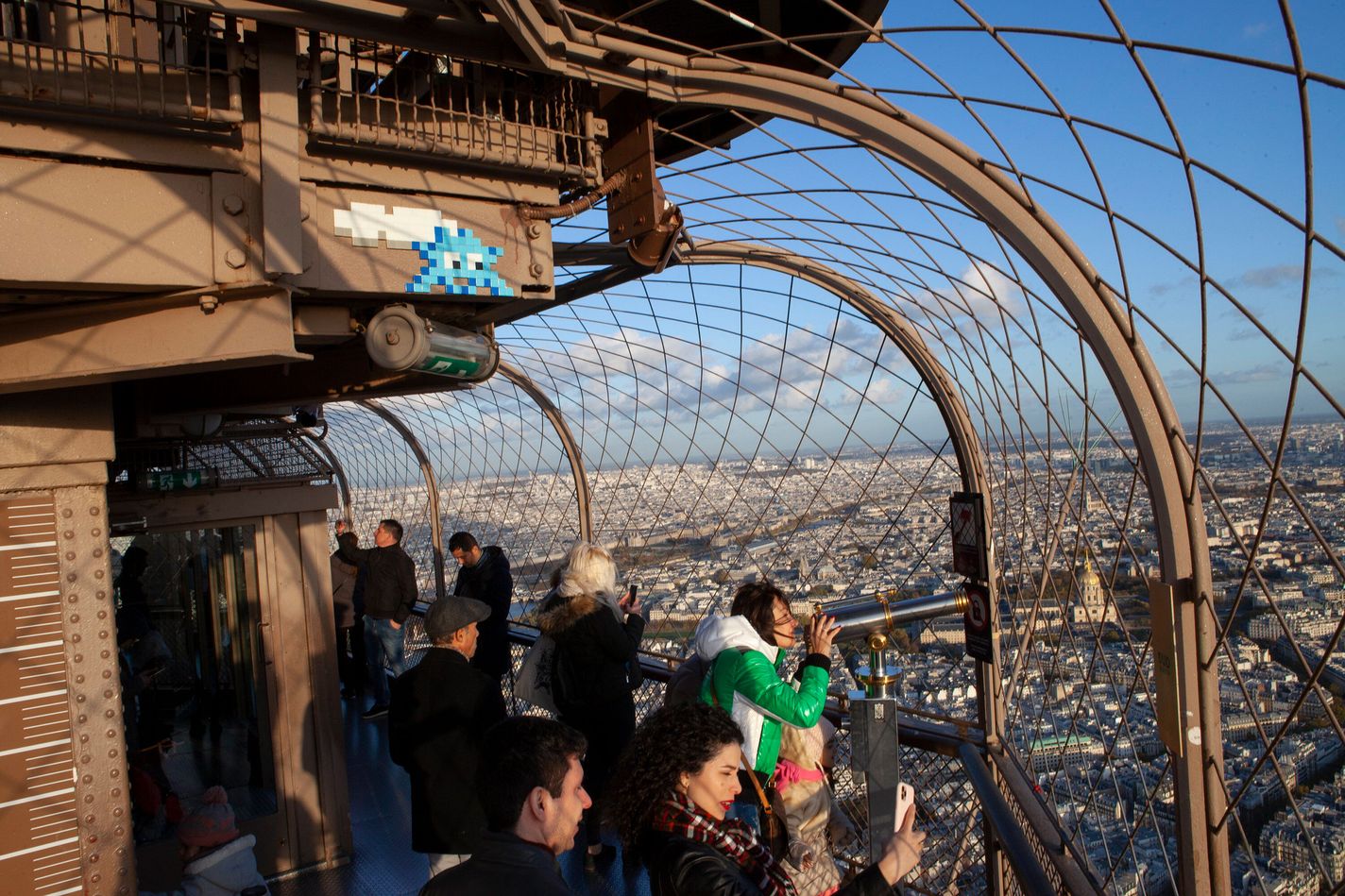 Invader mosaic seen on the Eiffel Tower. Paris.