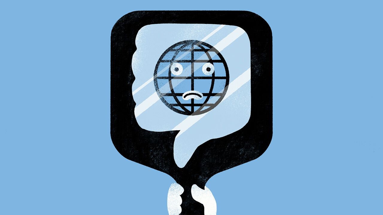 A sad globe reflected in a handheld mirror
