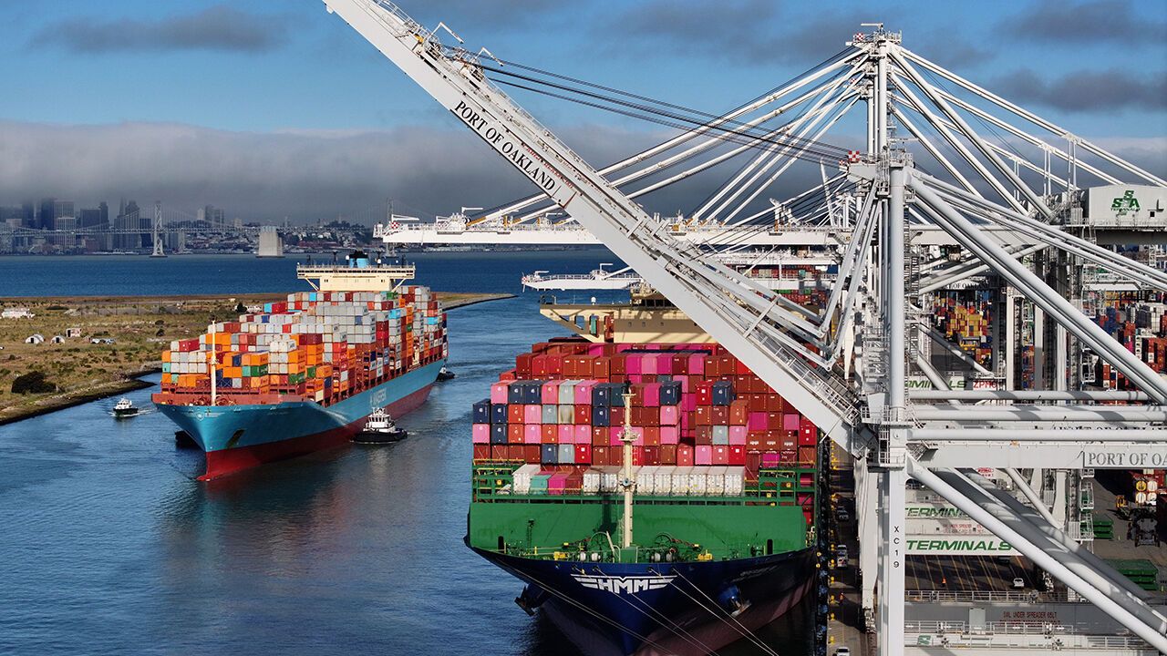An aerial view, a container ship arrives at the Port of Oakland on August 01, 2025 in Oakland, California.