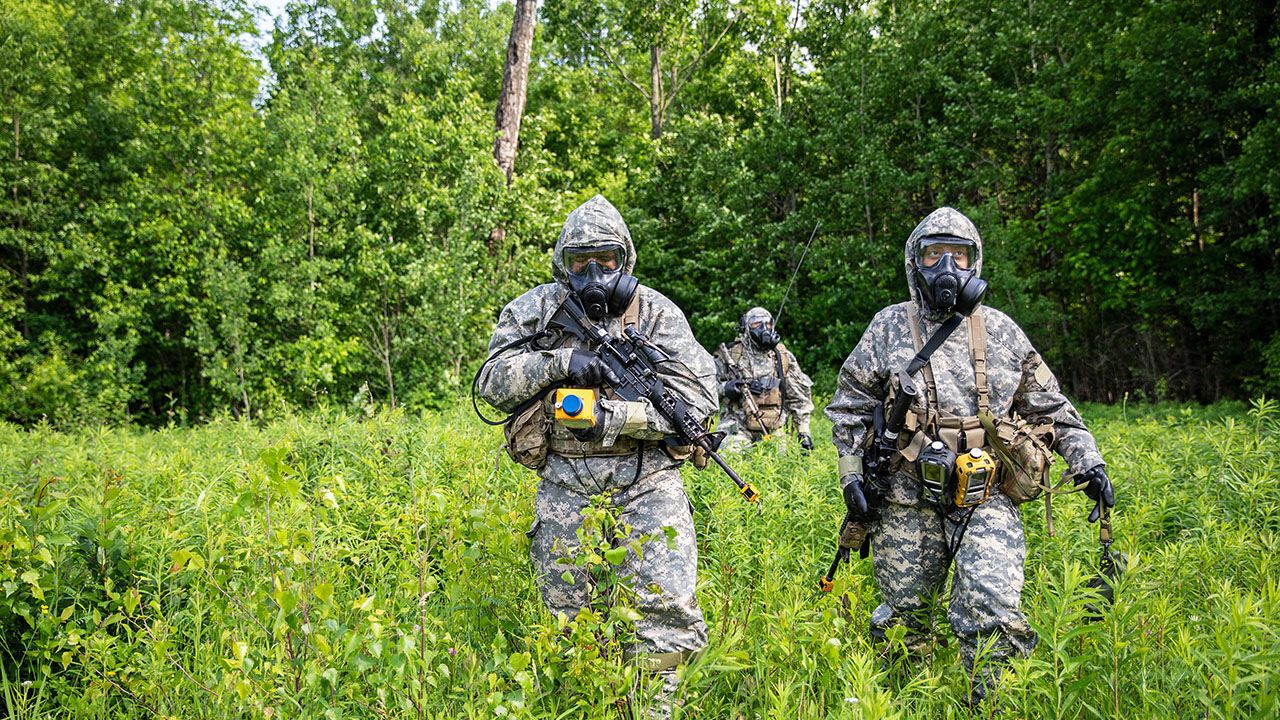 Soldiers equipped with advanced sensors and analytical tools to detect, identify, and characterize CBRN agents, including chemical warfare agents, biological agents, radiological materials, and nuclear weapons.