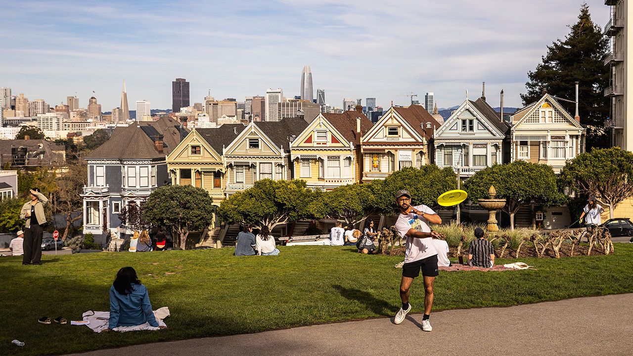 Visitors are seen at Alamo Square Park across the street from The Painted Ladies in San Francisco