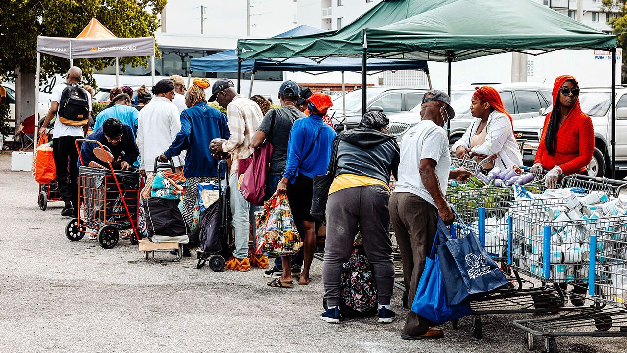 Residents wait in line at a food bank in Florida.