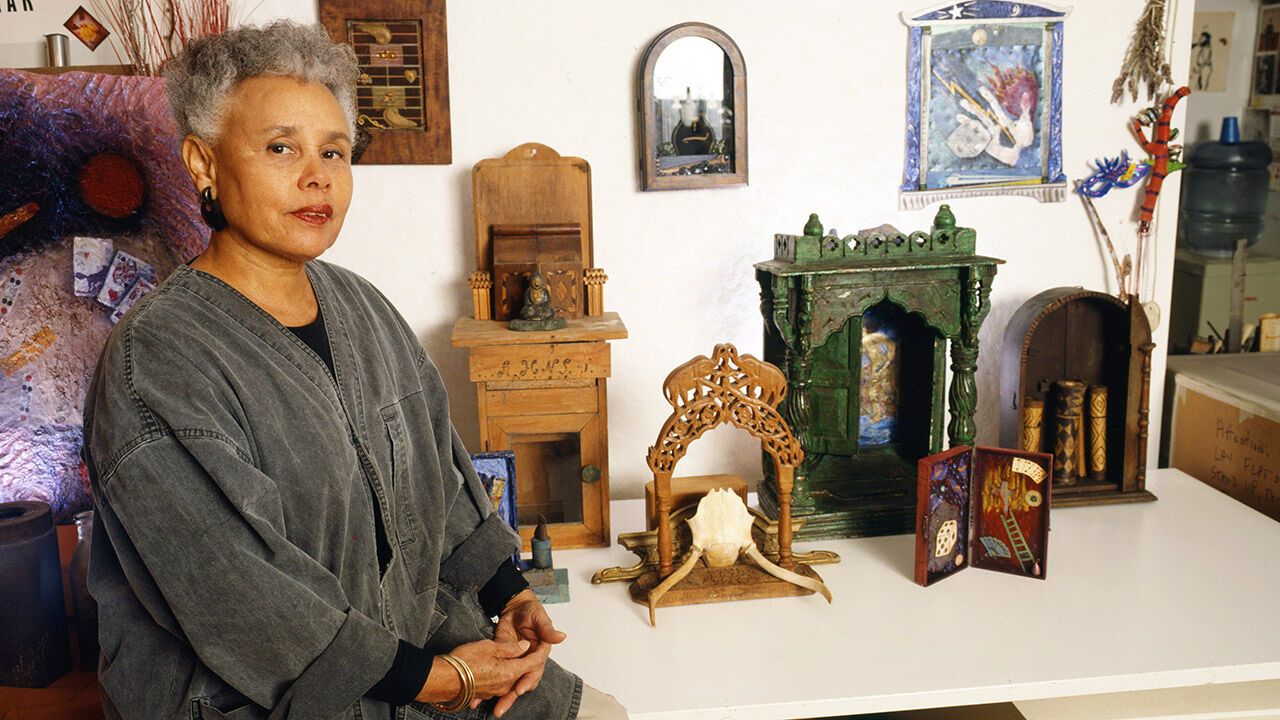 Betye Saar as she poses in her studio, New York, 1980s