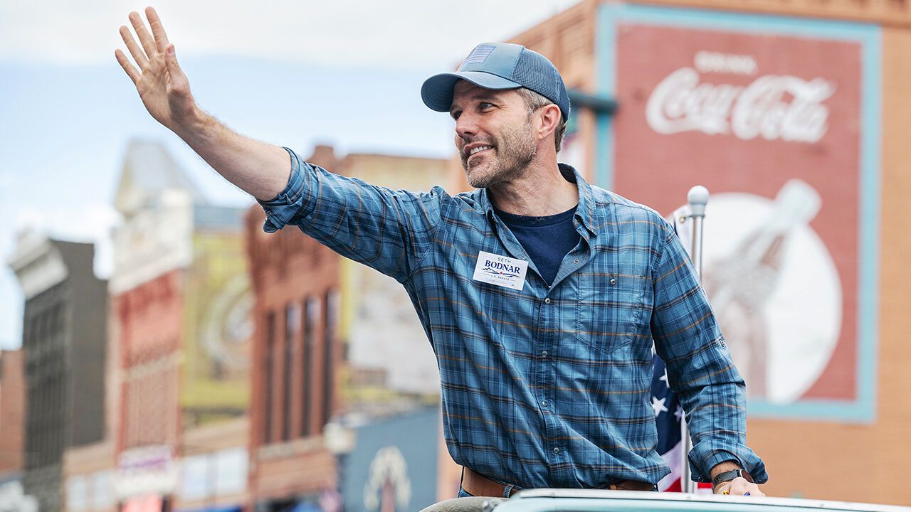 Seth Bodnar waves to the crowd at the annual Roundup Rodeo Parade.