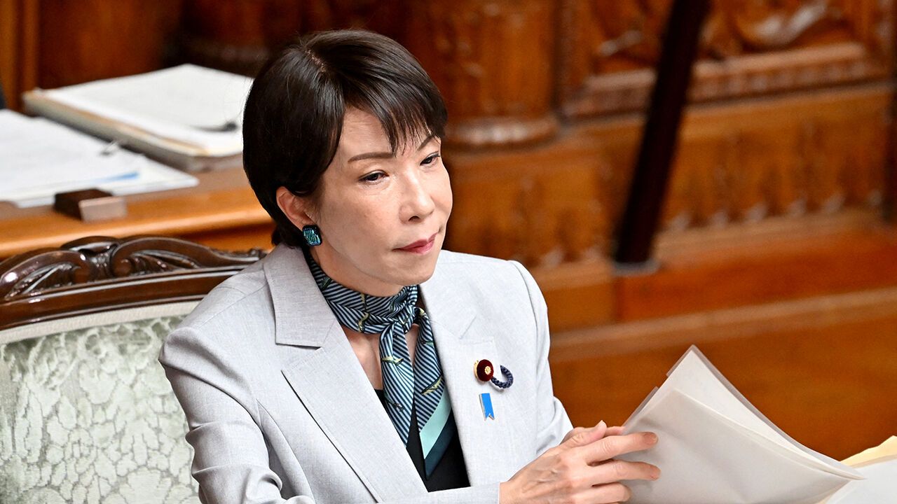 Japan's Prime Minister Sanae Takaichi listens to questions regarding the bill to establish the National Intelligence Council during a House of Councillors plenary session at the parliament in Tokyo on May 8, 2026.