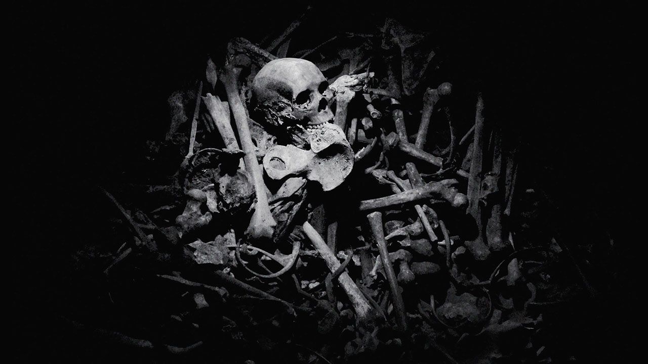 Genocide memorial showing bones and a skull in Rwanda.