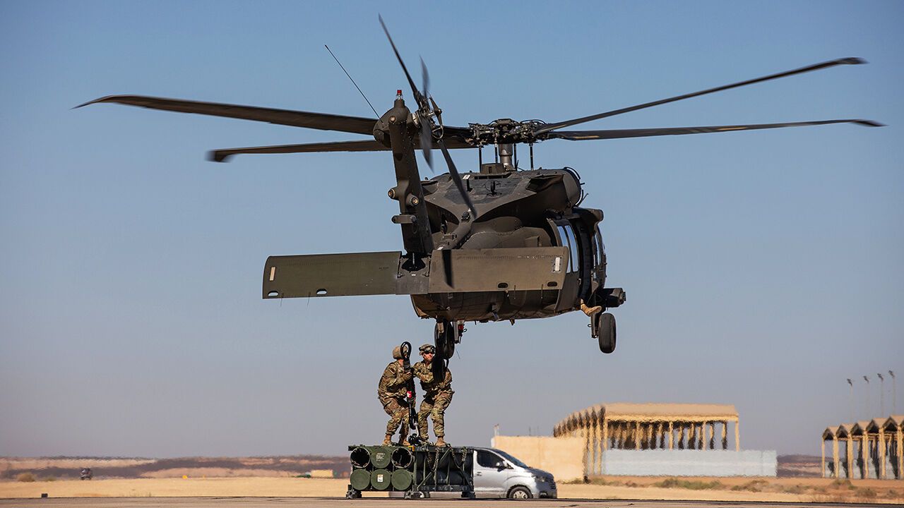 U.S. Army soldiers, assigned to Task Force Hurricane, conduct sling load operations with a U.S. Army UH-60 Blackhawk helicopter