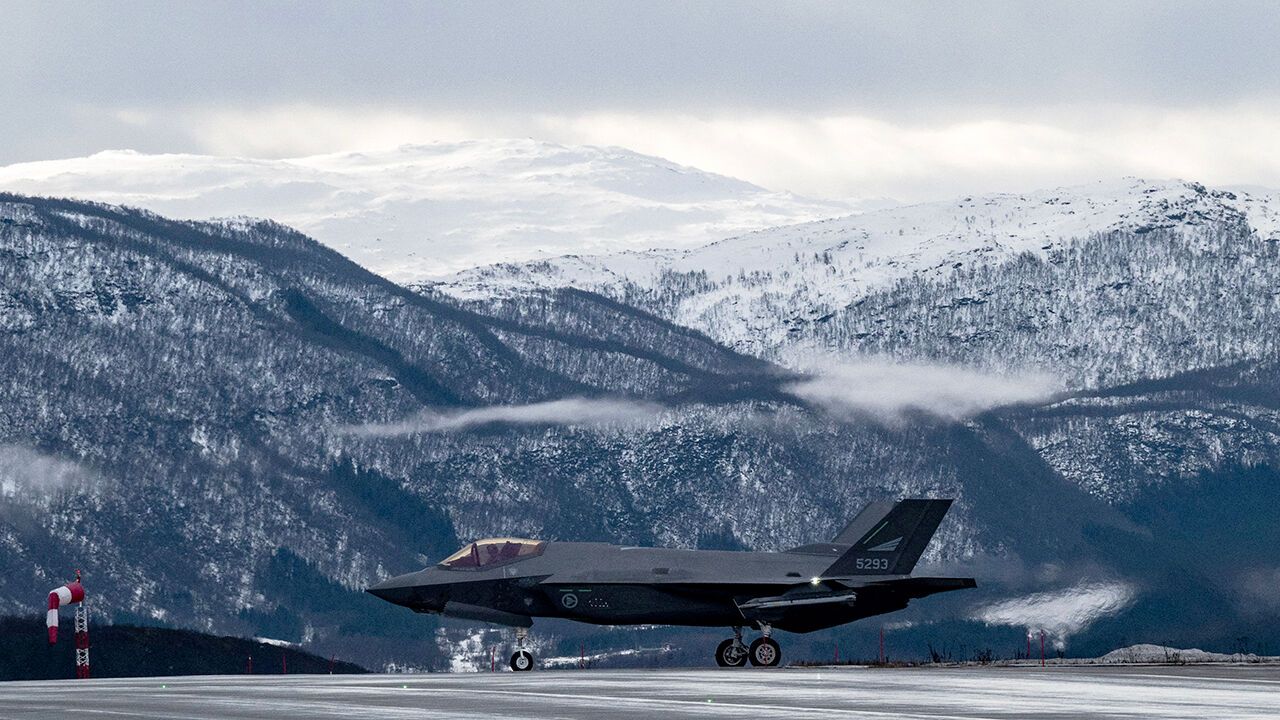 A US-made F-35 fighter aircraft of the Royal Norwegian Air Force taxies to its hangar after landing at Evenes Airbase, near Narvik on March 11, 2026, as NATO conducts its Cold Response military exercise.