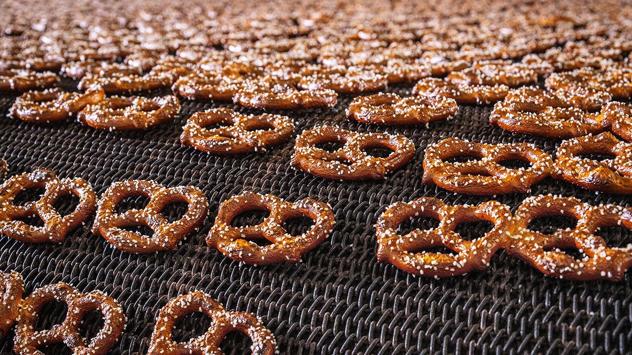 Pretzels being baked in commercial bakery, USA