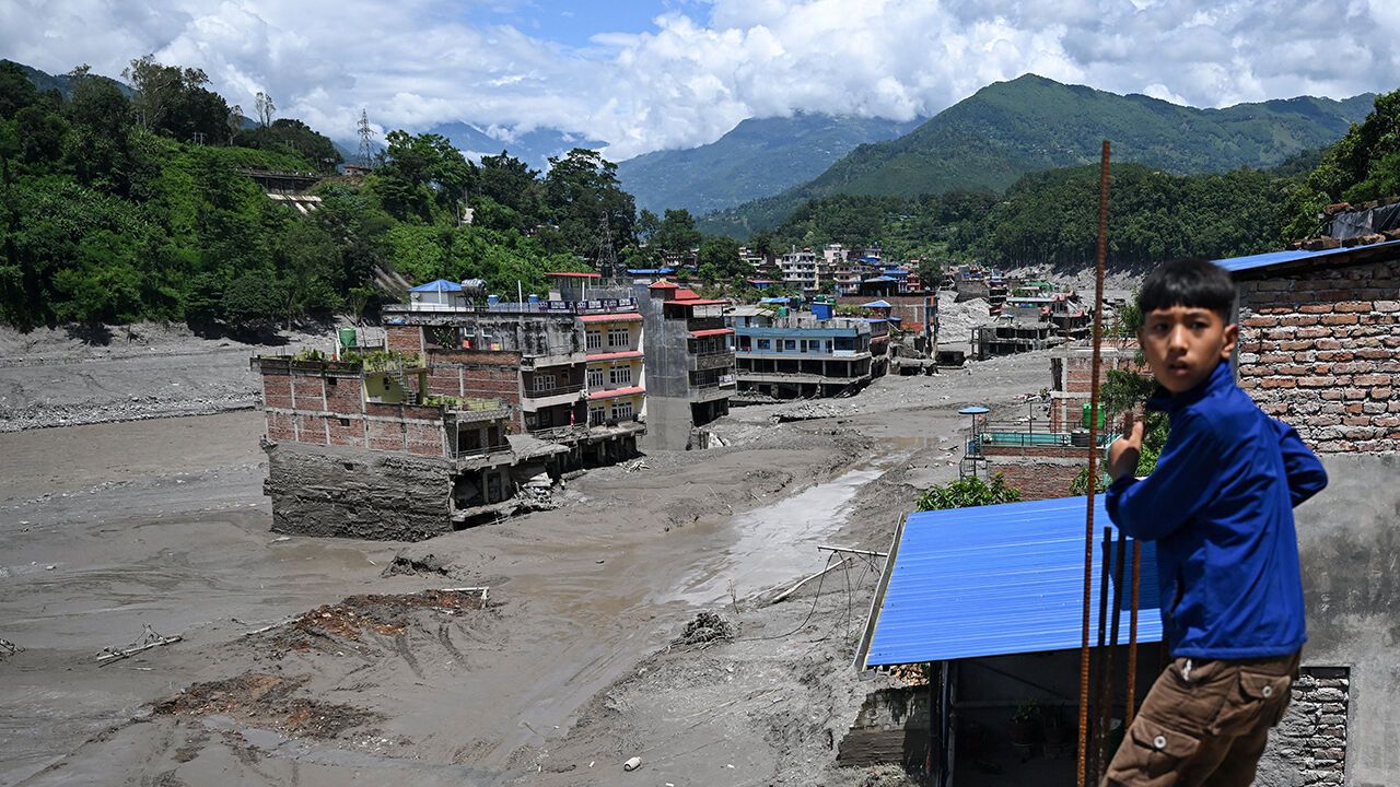 A general view shows houses lying deluged in sludge after flash floods at Trishuli in Nepal's Nuwakot district on August 27, 2026.