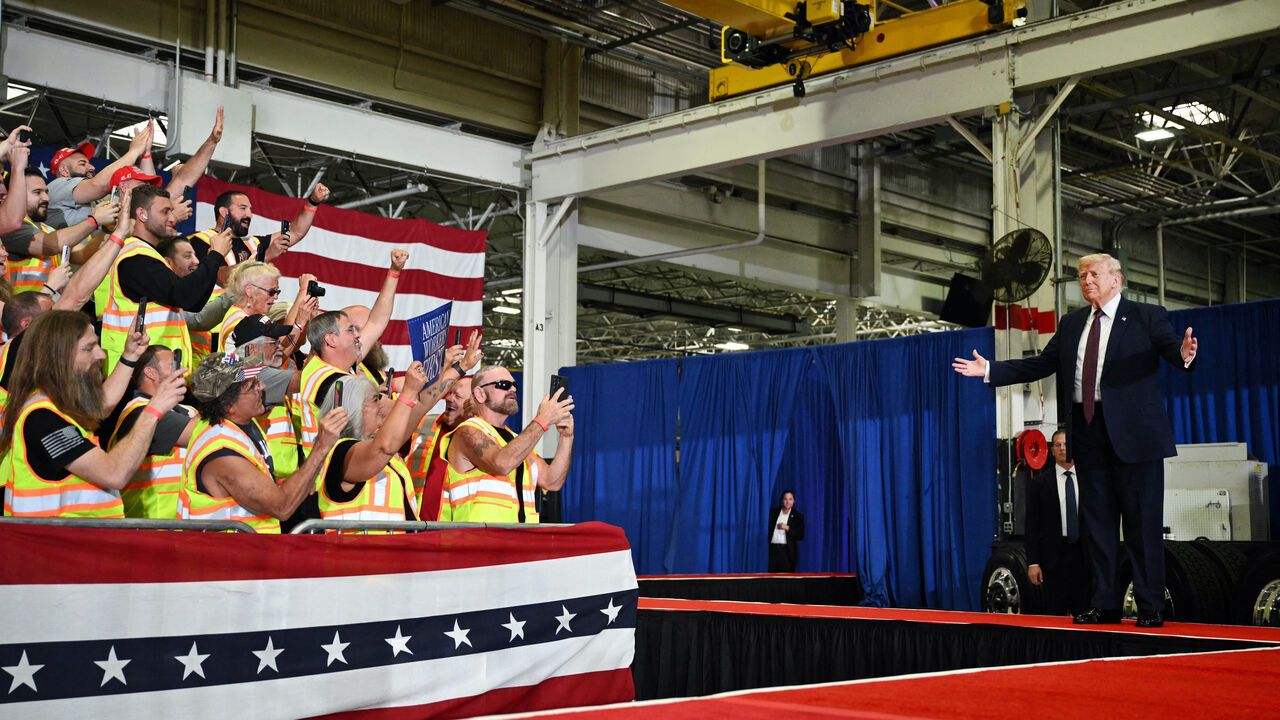 US President Donald Trump gestures as he arrives to speak during a visit to the Mack Trucks manufacturing facility in Macungie, Pennsylvania.
