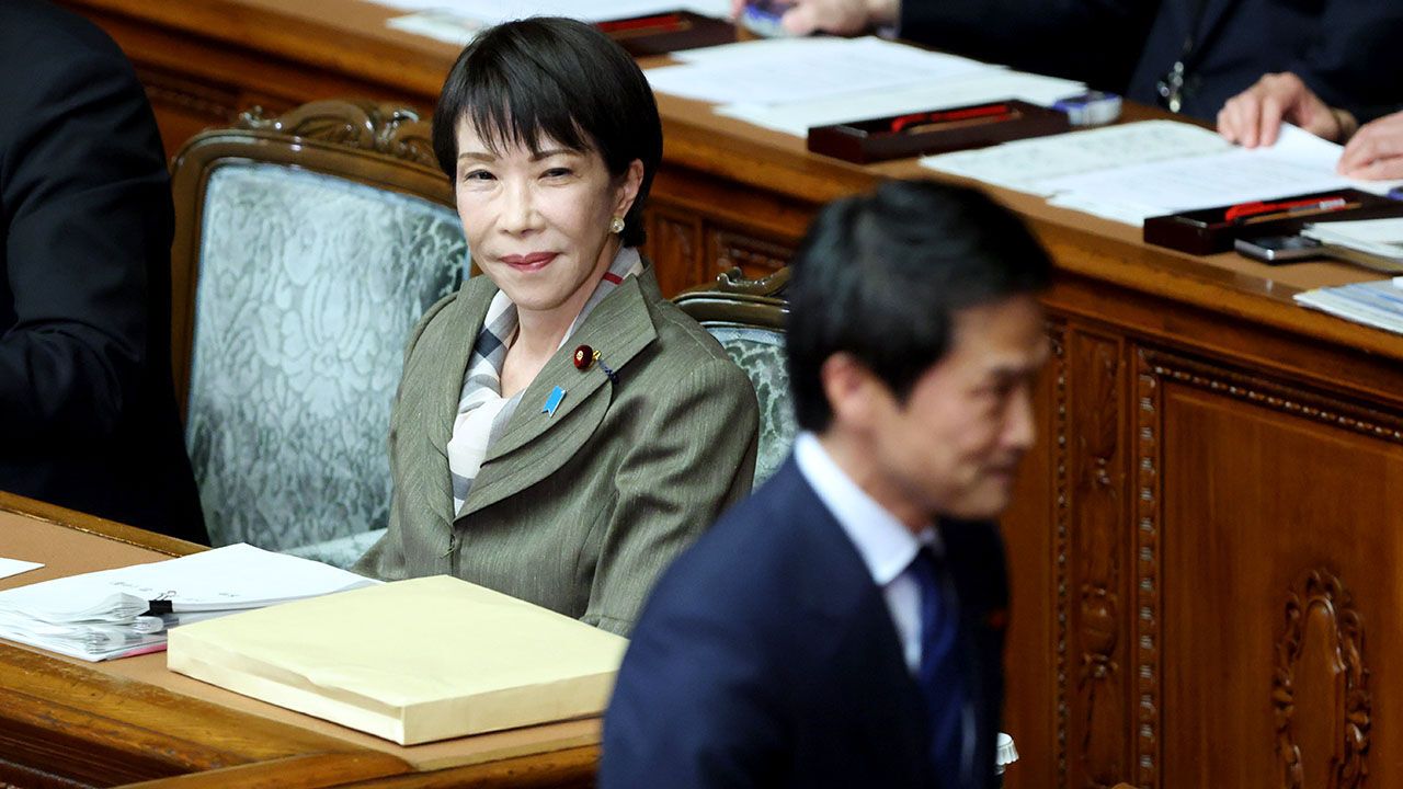 Sanae Takaichi, Japan's prime minister, looks at Junya Ogawa, leader of the Centrist Reform Alliance, during a special session in the lower house of parliament in Tokyo