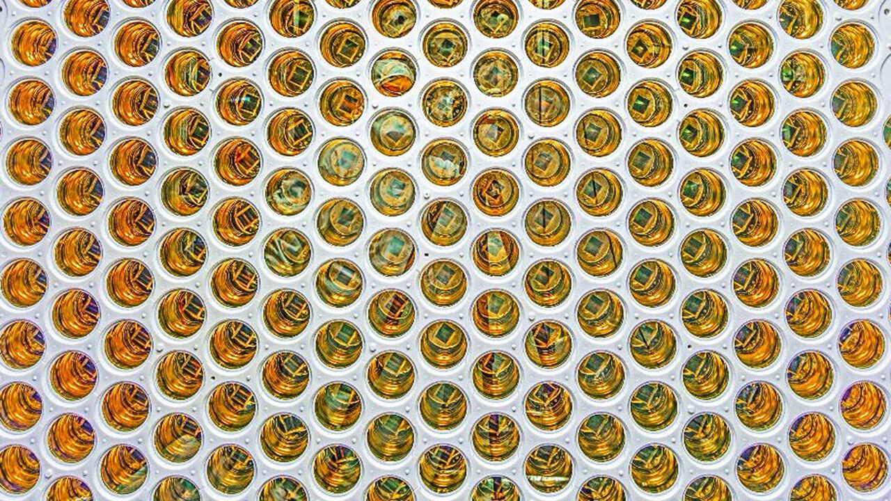 Photo of the circular array of golden photomultiplier tubes LUX-ZEPLIN experiment. Sanford Underground Research Facility (SURF) in South Dakota.