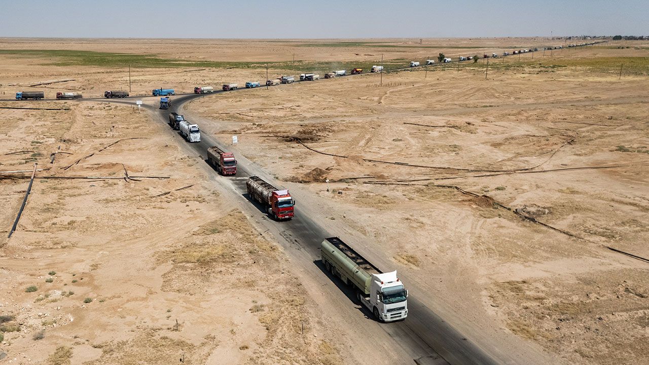 A convoy of tanker trucks carrying crude oil through Syria